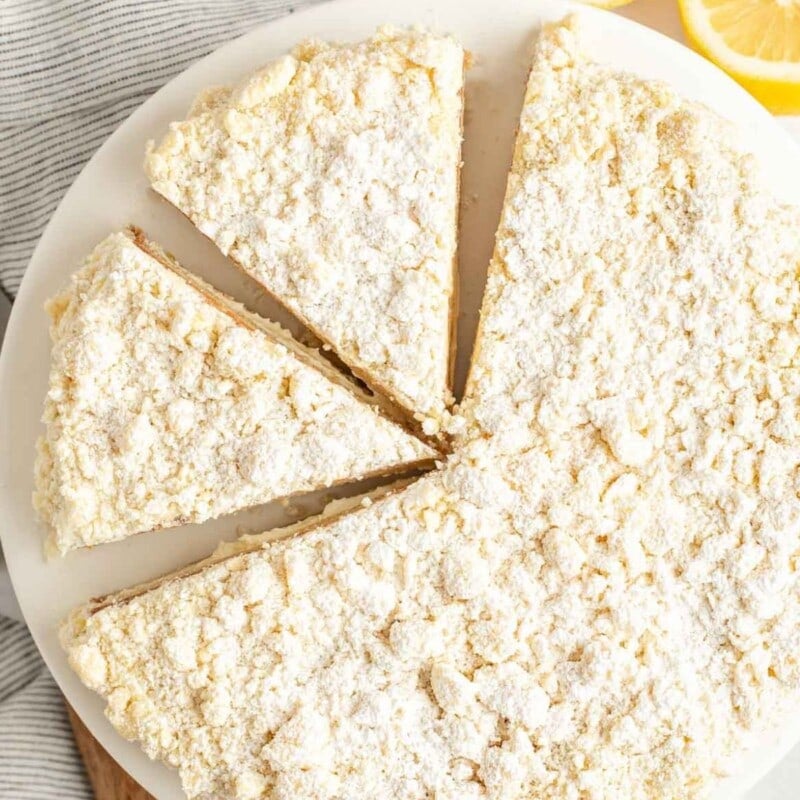 Lemon cream cake sliced into triangles.