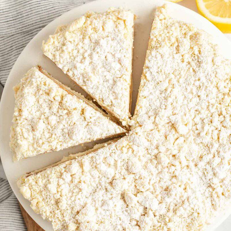 Lemon cream cake sliced into triangles.