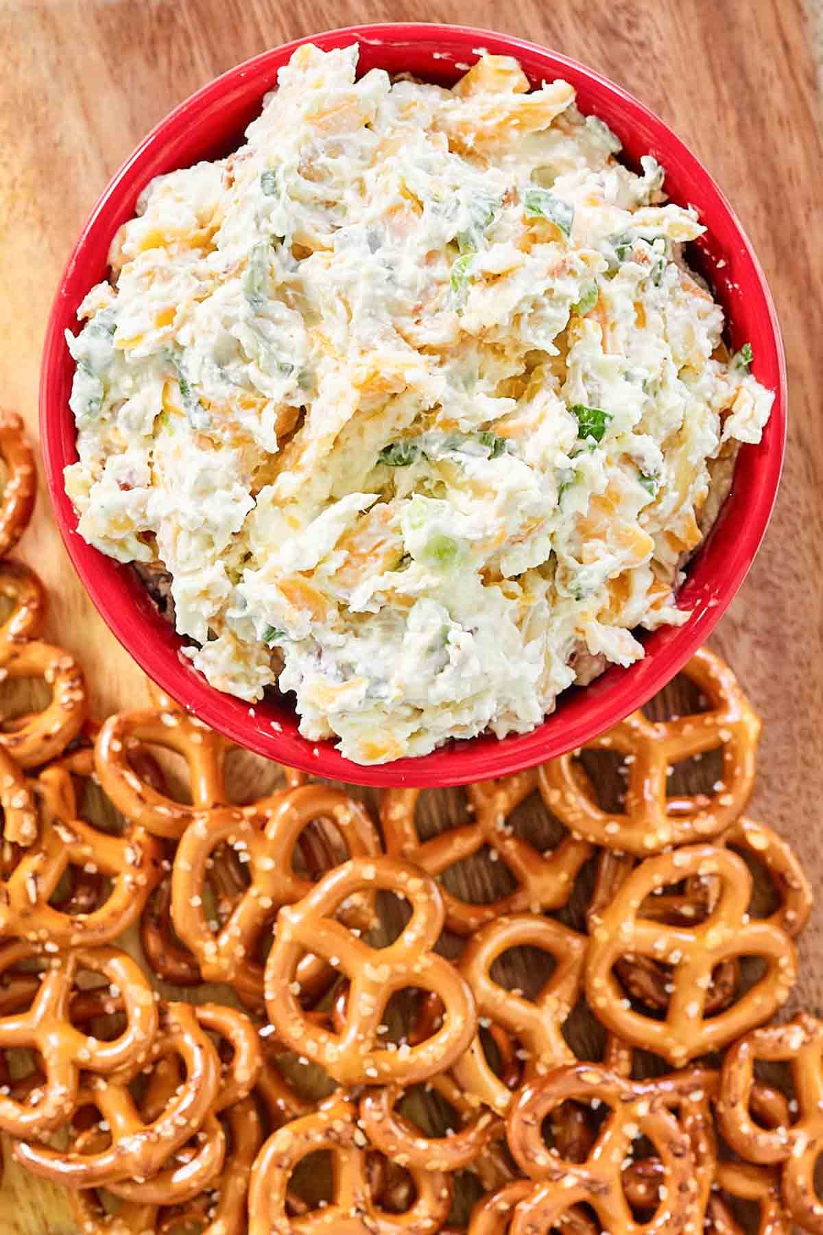 Bacon cheddar cream cheese onion dip served with mini pretzels.