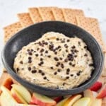 Buckeye dip on a platter with apple slices and graham crackers.