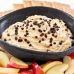 Homemade buckeye dip served with apple slices and graham crackers.