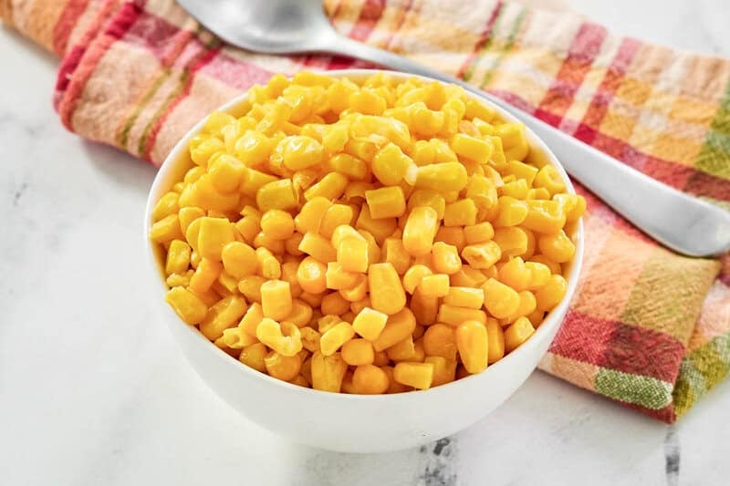 A bowl of buttered sweet corn.