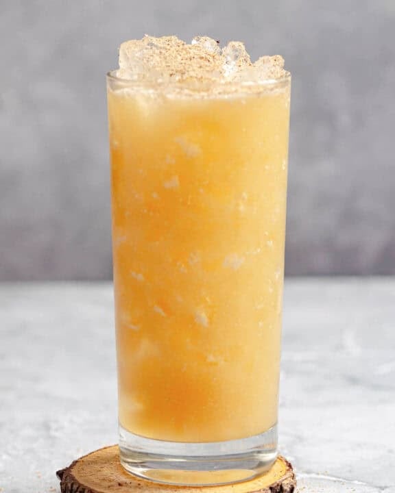 A fruity tropical rum cocktail in a tall glass.