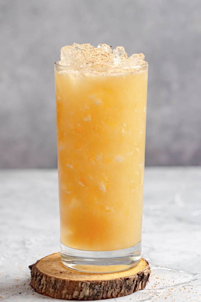 A fruity tropical rum cocktail in a tall glass.