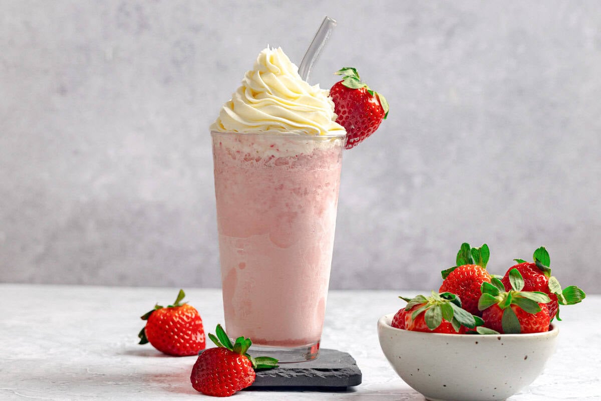 A strawberry creme frappe and fresh strawberries.