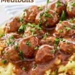 Mississippi meatballs over mashed potatoes on a platter.
