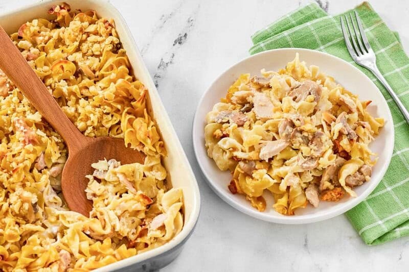 Crispy butter cracker topped casserole with tuna and mushrooms baked and served.