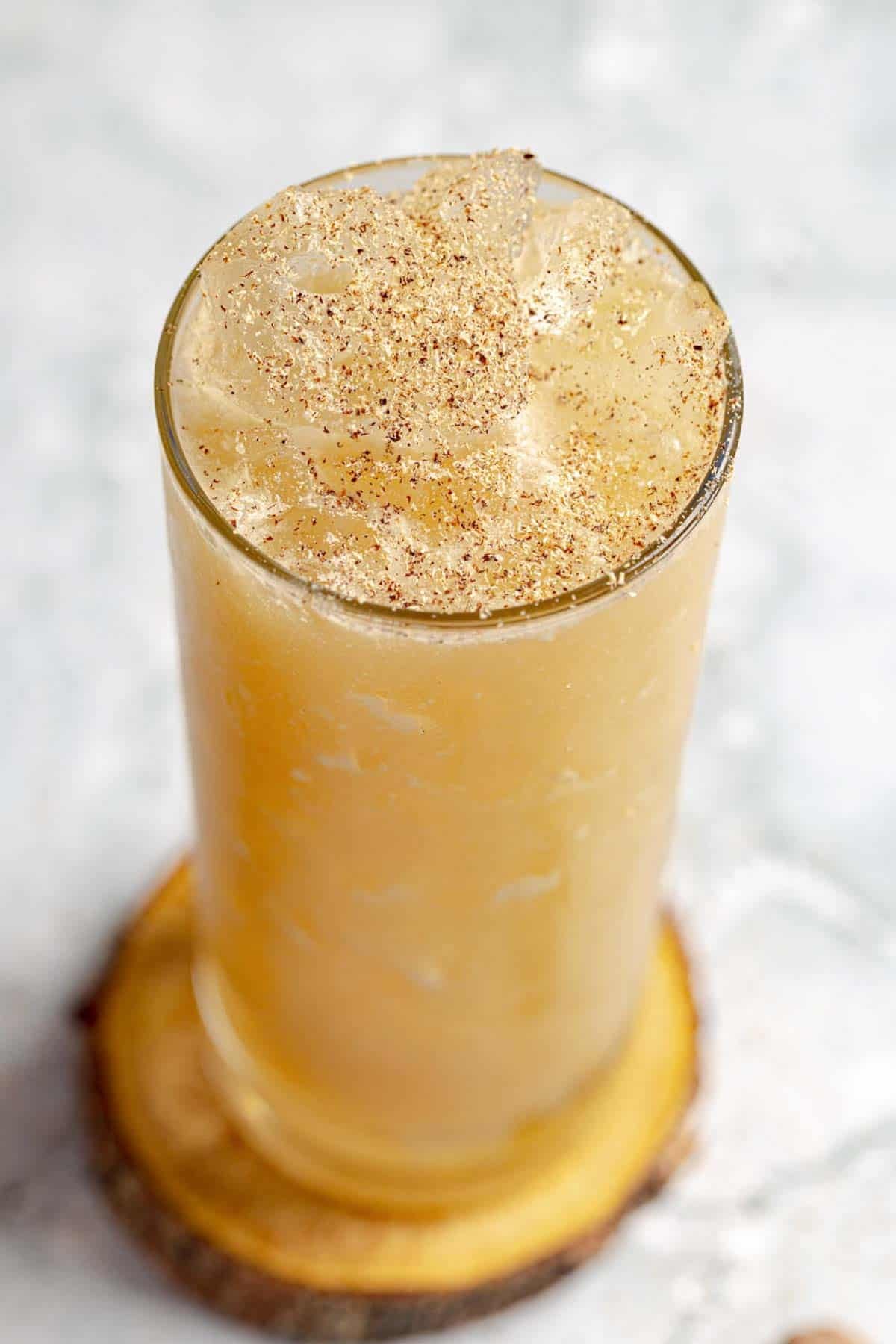 Nutmeg garnished tropical cocktail.