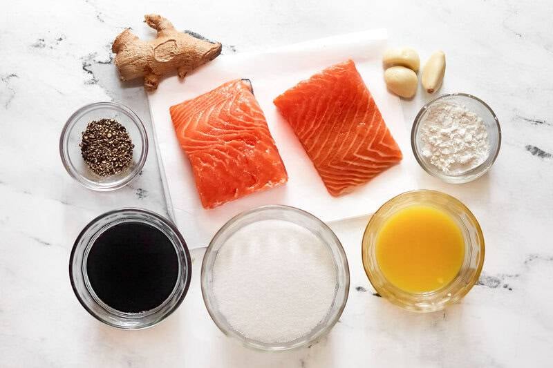 Salmon fillets, soy sauce, pineapple juice, ginger, garlic, sugar, pepper, and cornstarch.
