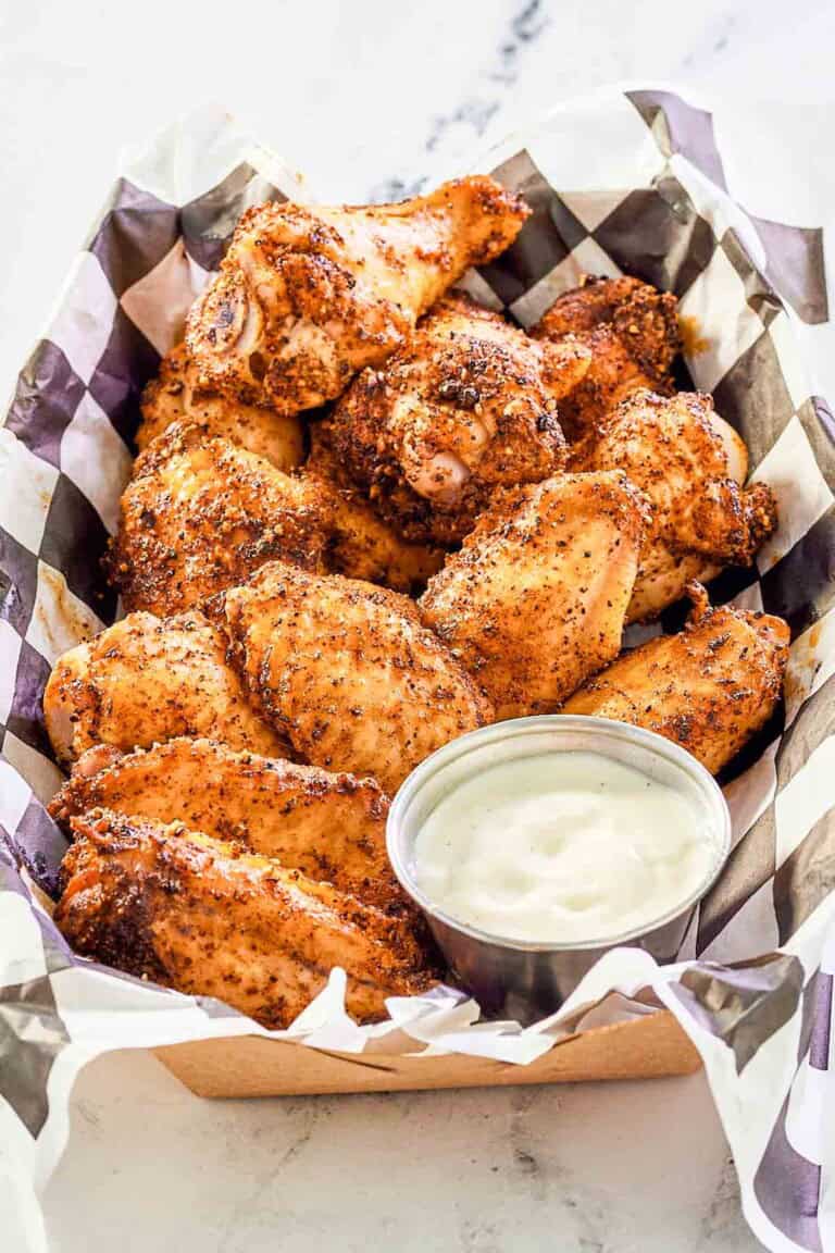 Seasoned and smoked chicken wings served with dipping sauce.
