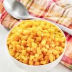 Buttery sweet corn kernels served in a small bowl.