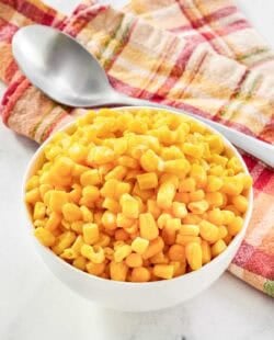 Buttery sweet corn kernels served in a small bowl.