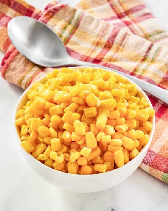Buttery sweet corn kernels served in a small bowl.