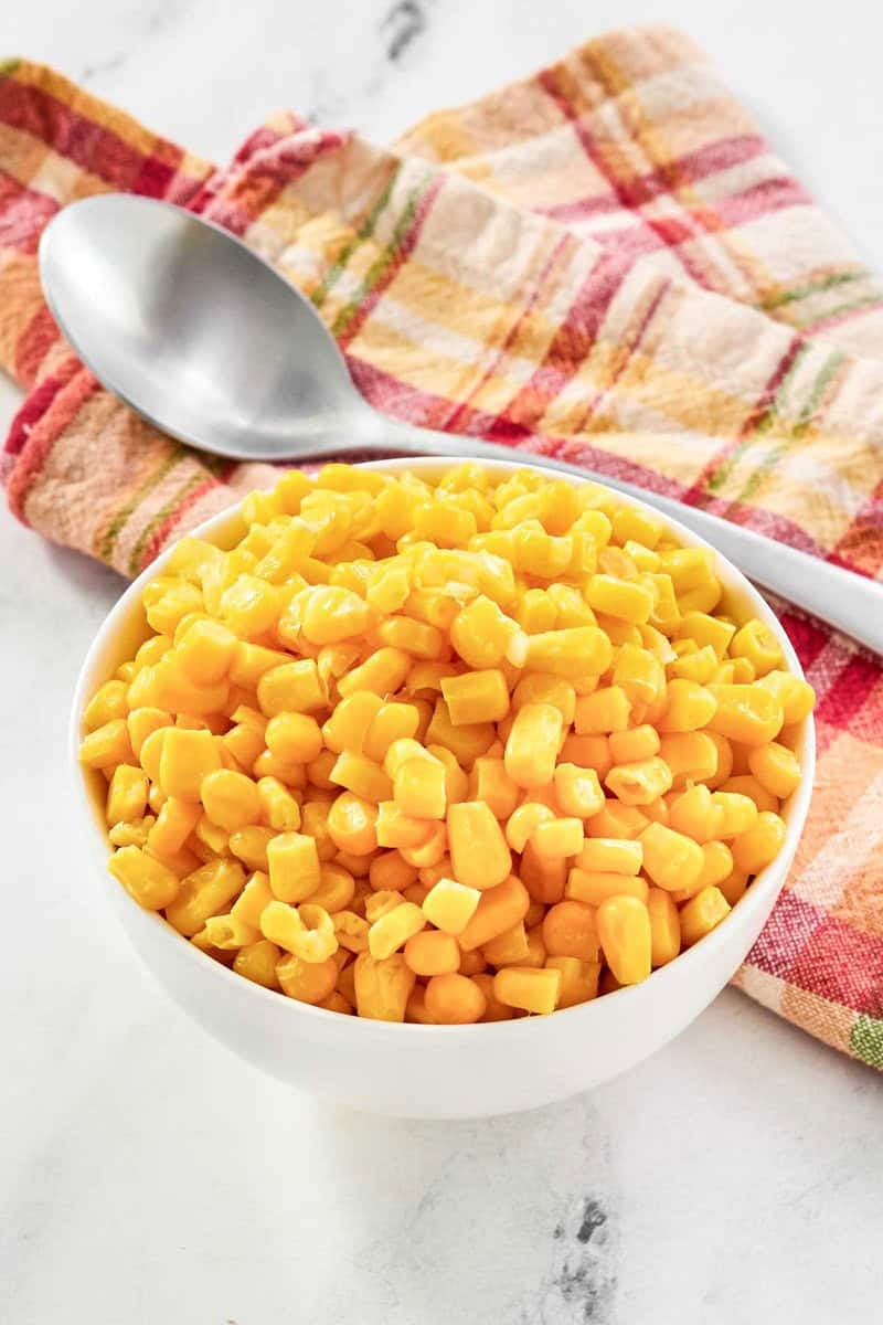 Buttery sweet corn kernels served in a small bowl.