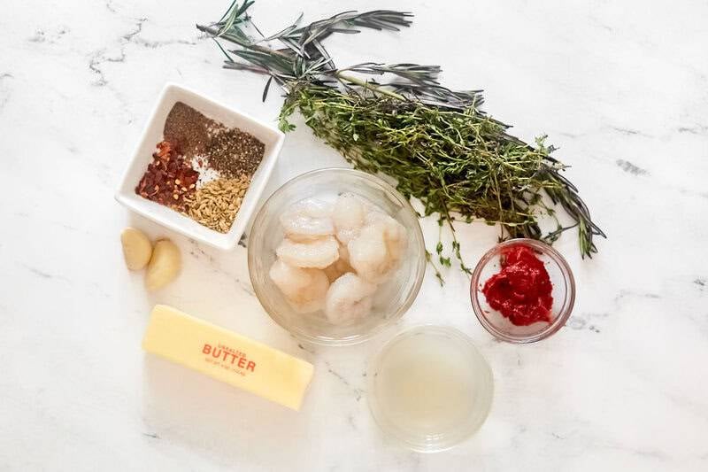 Shrimp, butter, tomato paste, garlic, herbs, and seasonings.