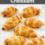 Copycat Starbucks ham and Swiss cheese croissants on parchment paper.