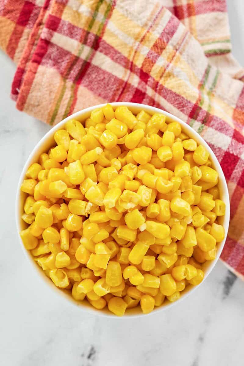 Sweet buttered corn kernels in a bowl.