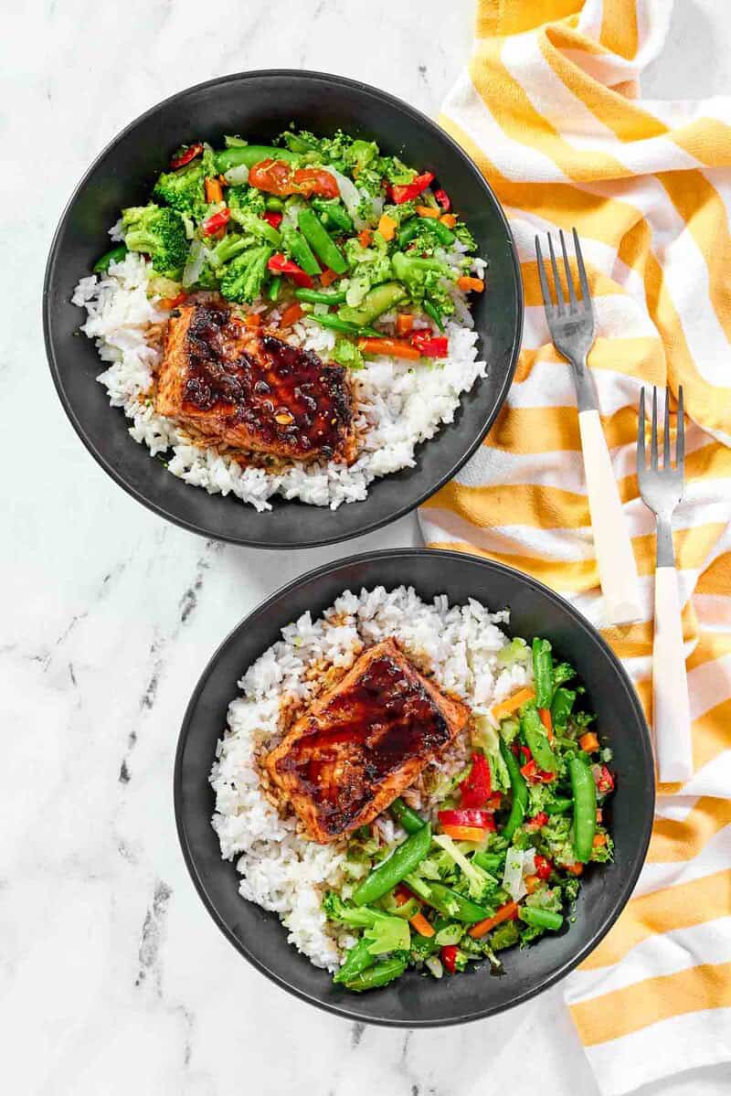 Grilled salmon with teriyaki sauce and mixed vegetables served over rice.