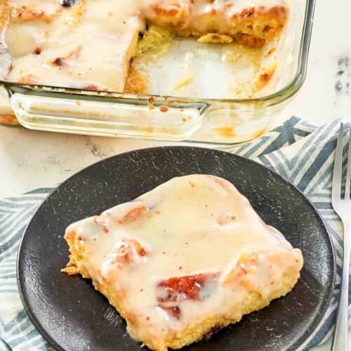 Bread pudding served and topped with sauce.