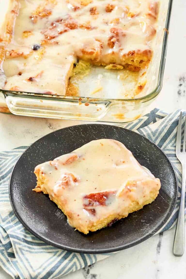 Bread pudding served and topped with sauce.