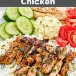 Cava harissa honey chicken served for dinner with rice, veggies, feta, and pita bread.