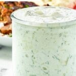 A jar of homemade CAVA tzatziki sauce.