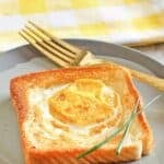 Copycat Cracker Barrel egg in a basket and a fork on a small plate.