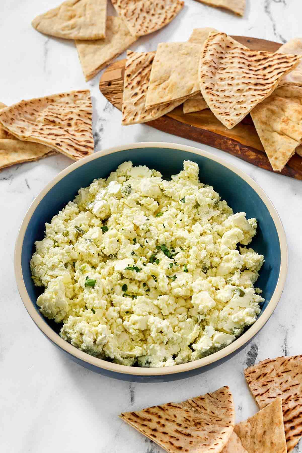 Feta cheese, onion, and jalapeno dip served with pita bread.