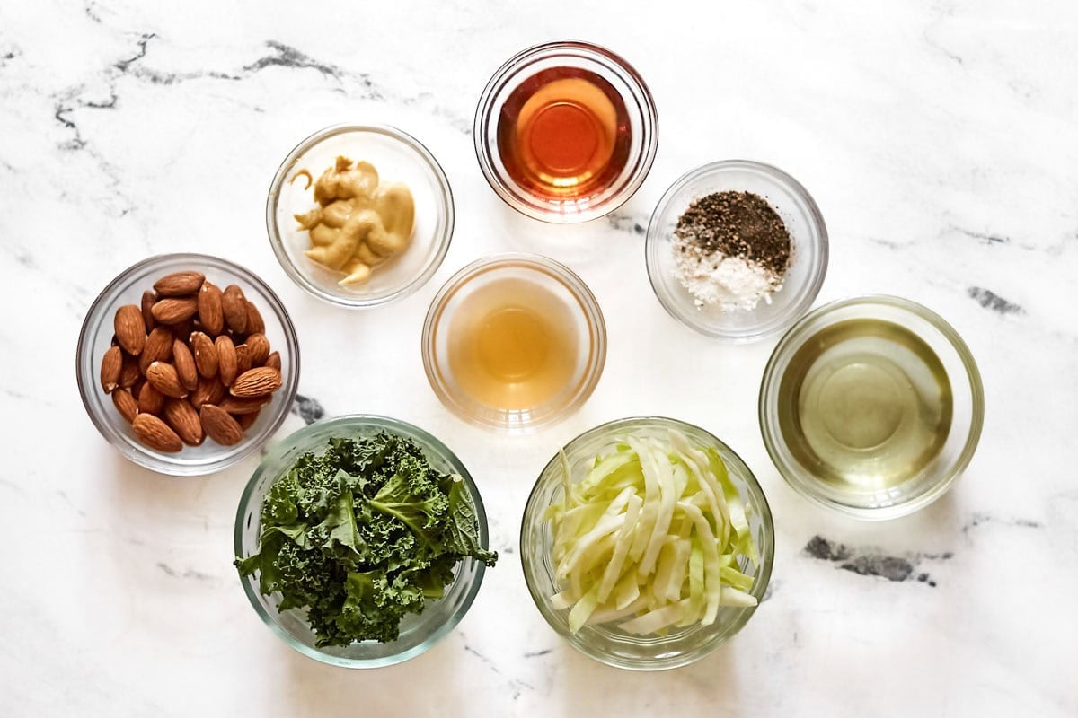 Kale, cabbage, almonds, oil, vinegar, mustard, and seasonings.
