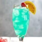 Copycat Olive Garden blue capri drink on a coaster.
