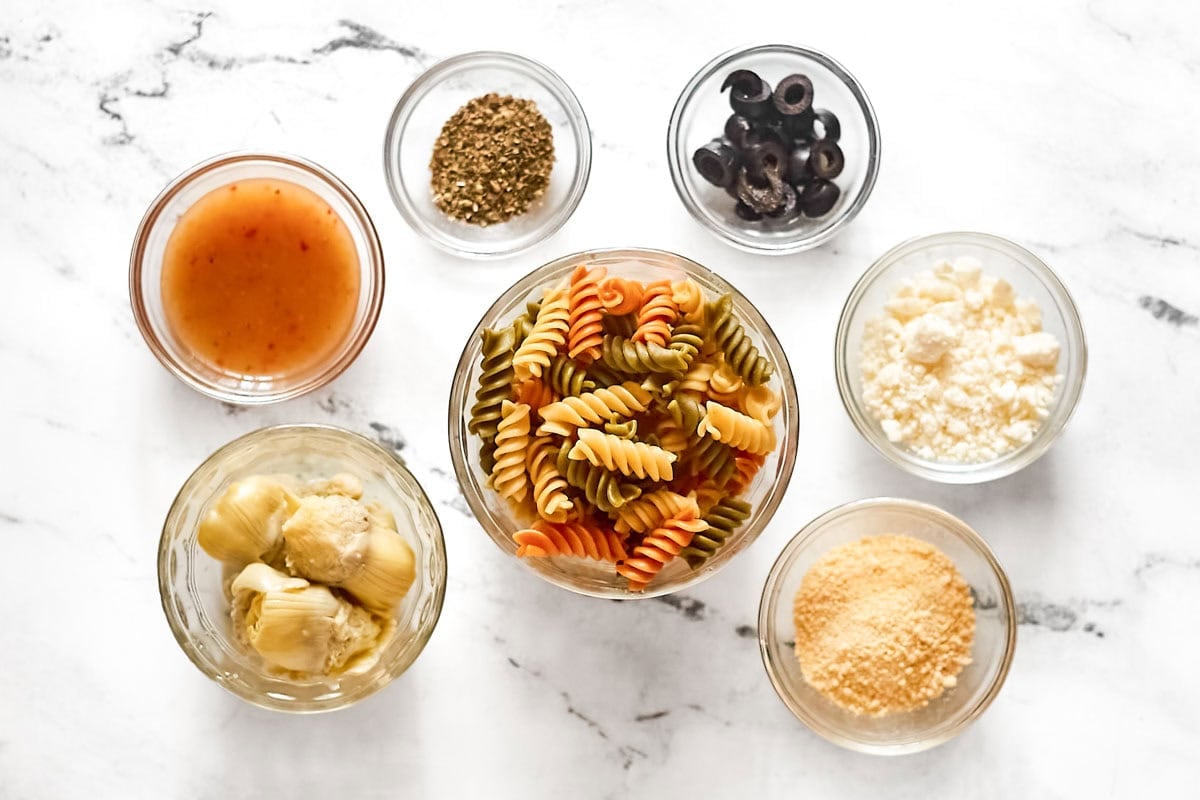 Rotini pasta, artichoke hearts, black olives, feta cheese, parmesan, and Italian dressing.