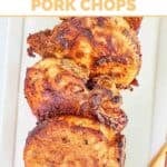 Several air fried thick pork chops on a platter.