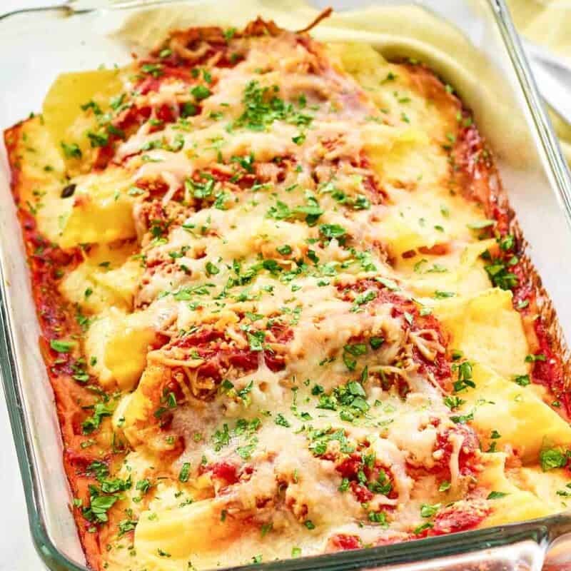 Baked cheese manicotti in marinara covered with cheese.
