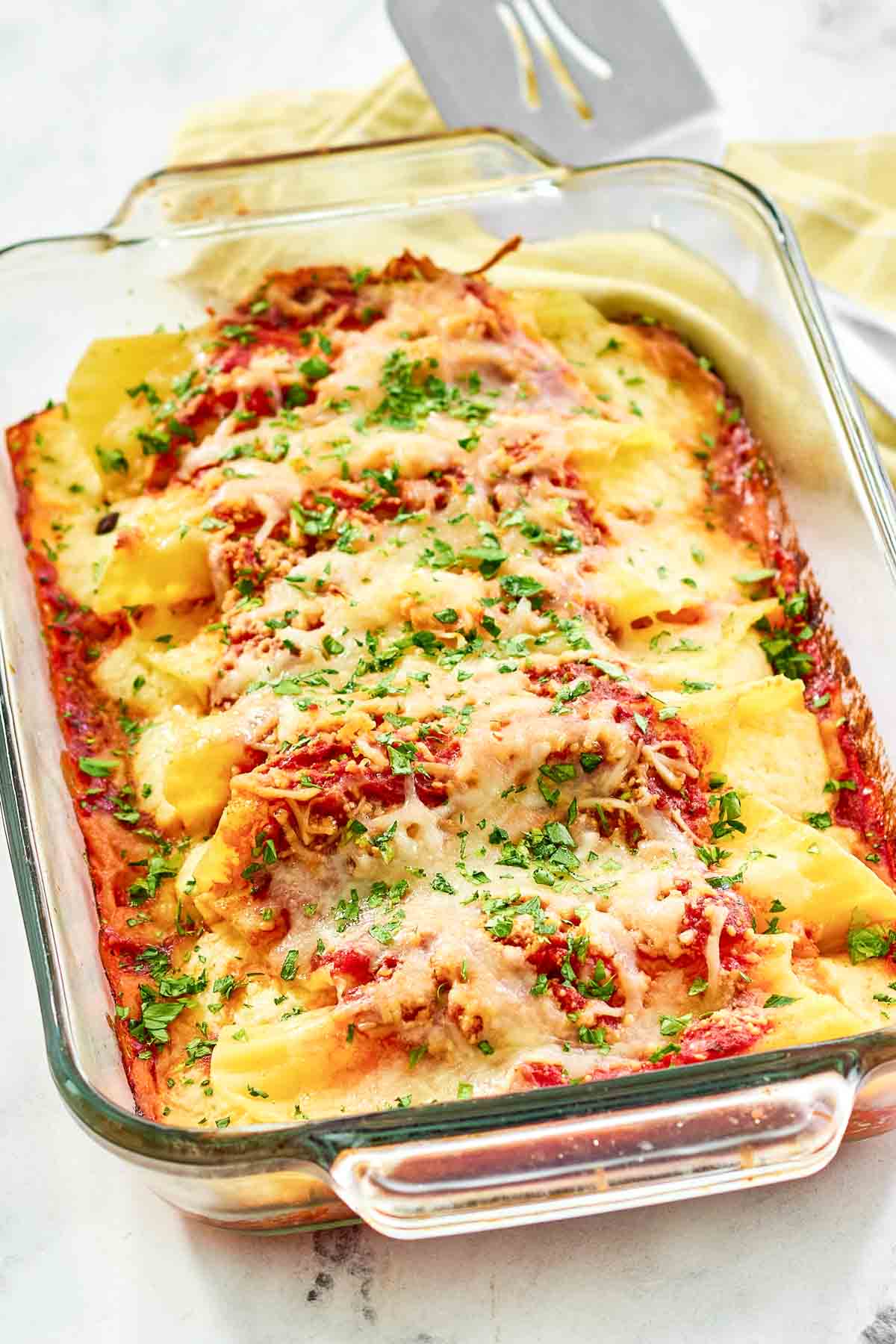 Baked cheese manicotti in marinara covered with cheese.