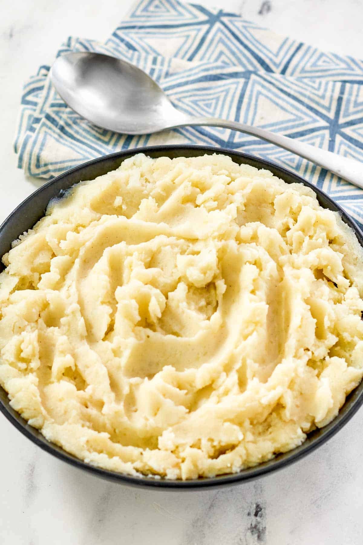 Buttermilk whipped potatoes in a serving bowl.