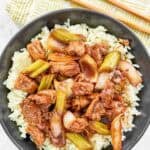Stir-fried chicken with veggies and black pepper sauce over rice.
