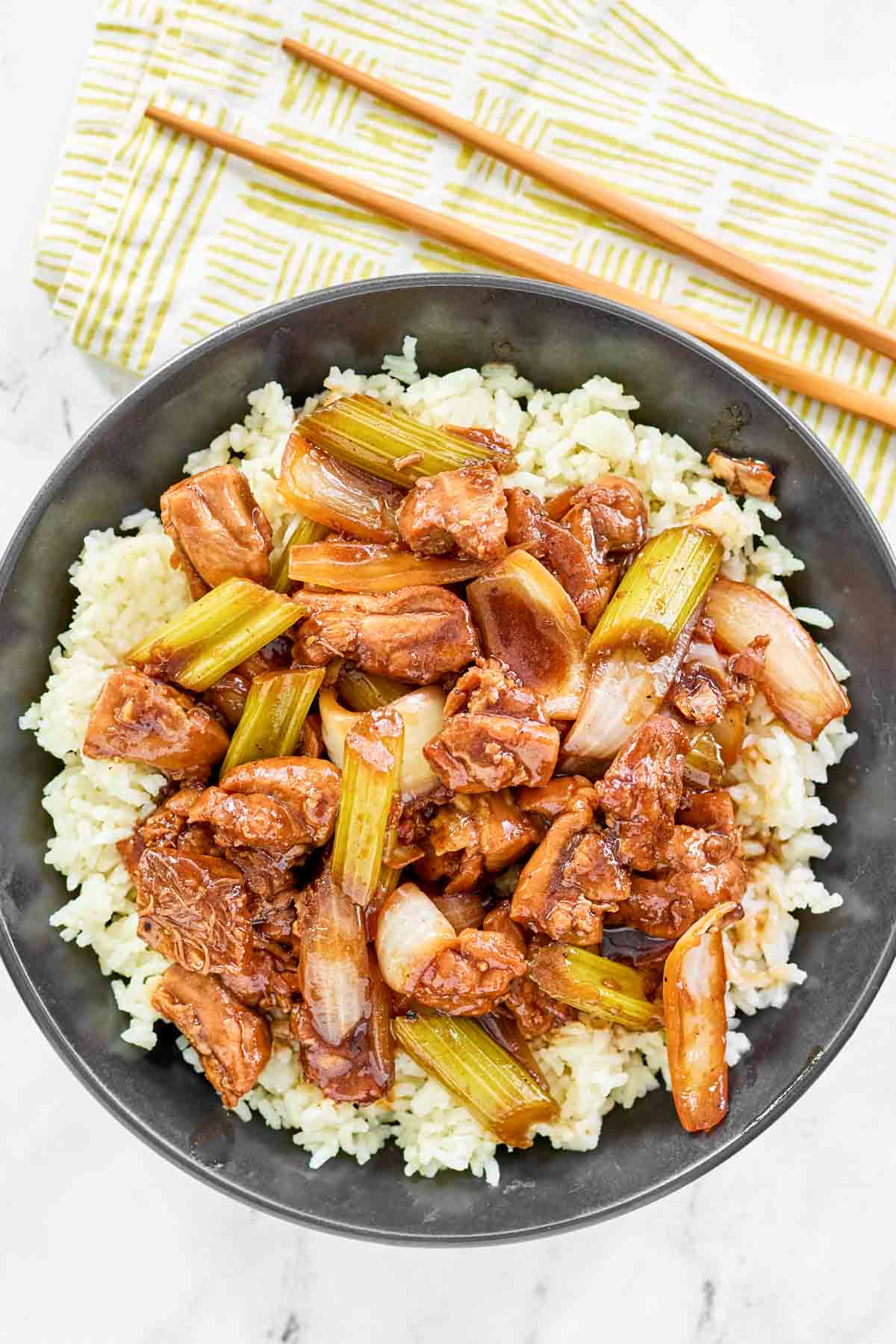 Stir-fried chicken with veggies and black pepper sauce over rice.