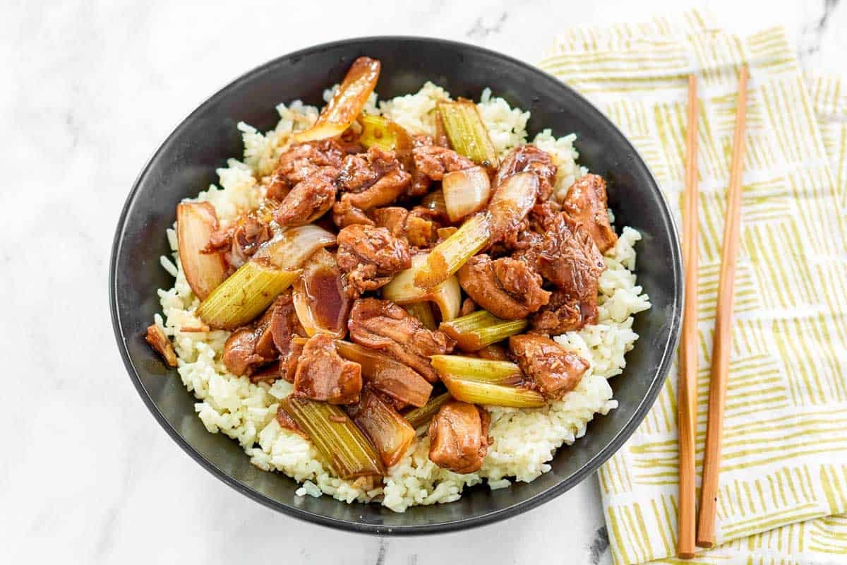 A Chinese chicken black pepper sauced dish with rice.