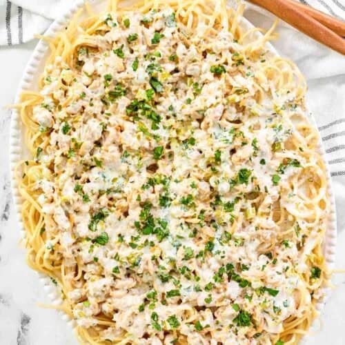 Creamy clam sauce served over pasta on a large platter.