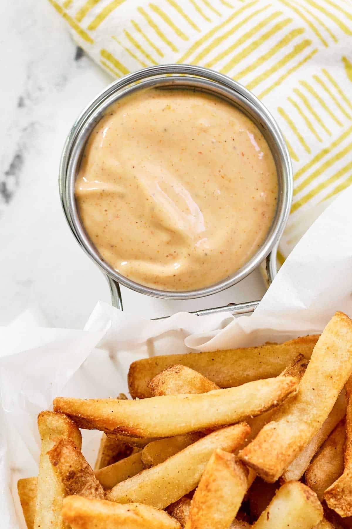 French fries served with a creamy seasoned sauce.