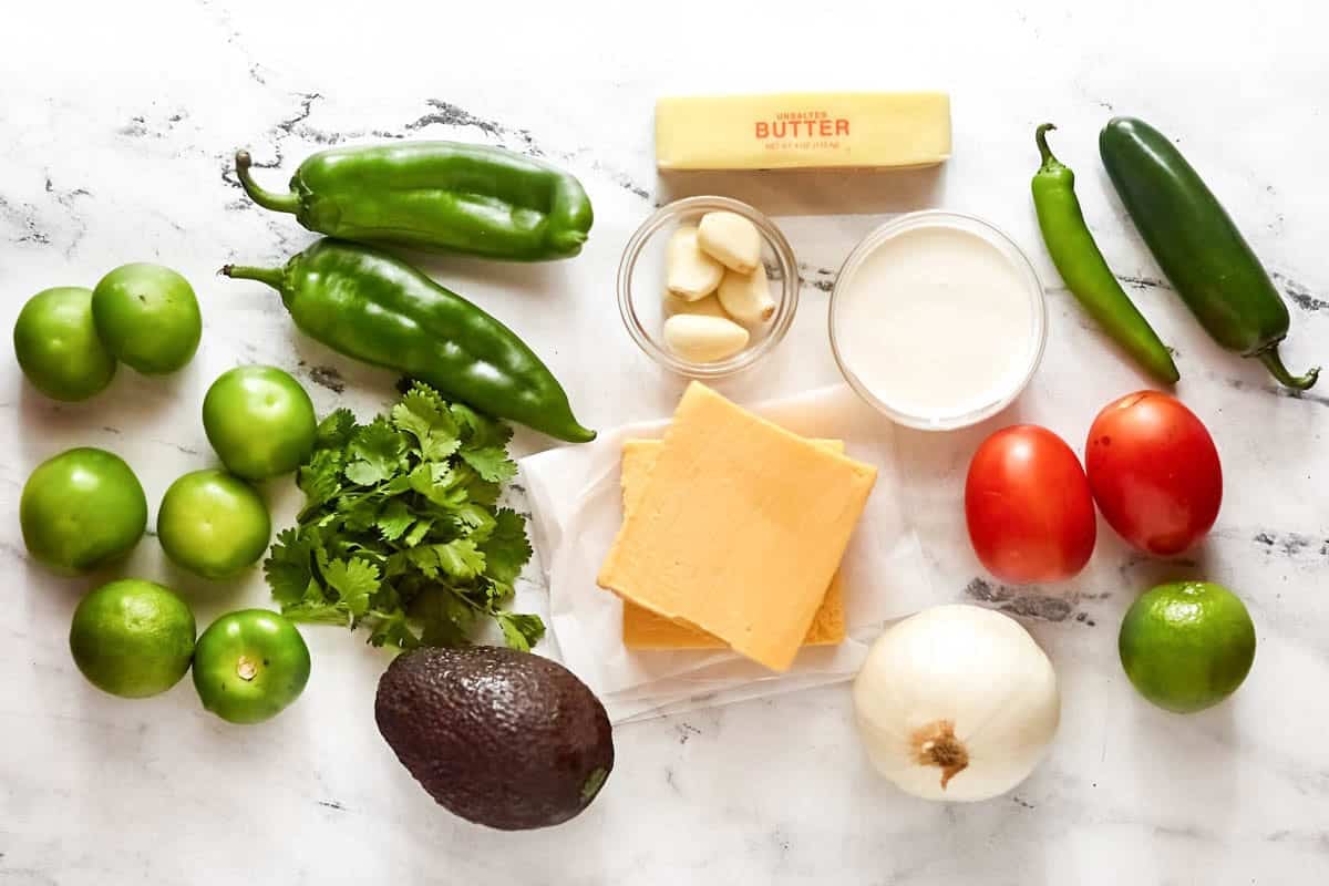 Green chile peppers, jalapenos, tomatillos, onion, garlic, cilantro, cheese, butter, and cream.