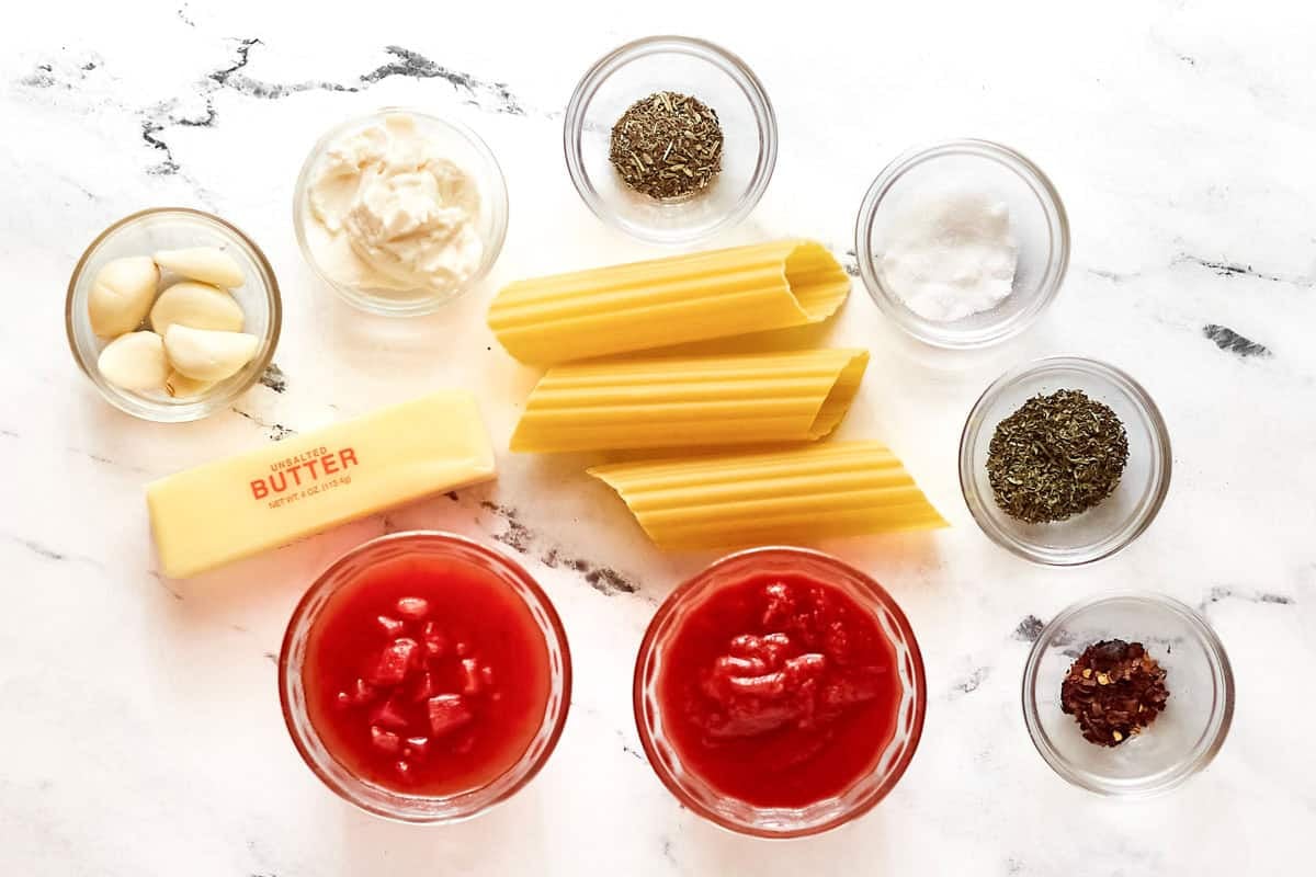 Manicotti, tomatoes, garlic, butter, cheese, and seasonings.