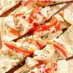 Slices of copycat Olive Garden grilled chicken flatbread.