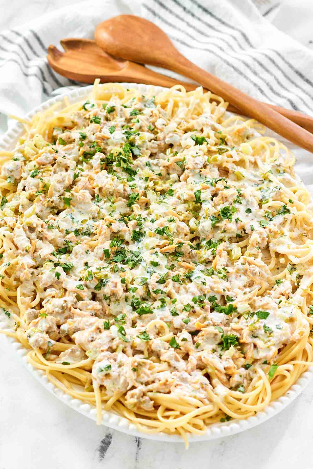 Pasta with creamy clam sauce on a large platter.