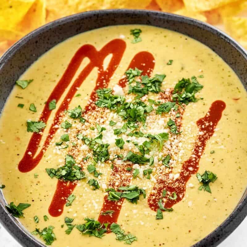 Queso made with green chiles and tomatillos served with guacamole.