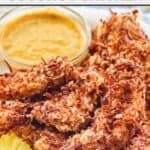 Copycat Rainforest Cafe caribou coconut chicken tenders and honey mustard sauce.