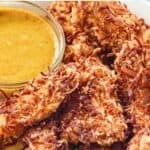 Copycat Rainforest Cafe caribou coconut chicken served with honey mustard sauce.