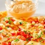 Copycat Taco Bell quesadilla sauce in a small bowl behind quesadillas.