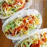 Three soft tacos with copycat Taco Bell taco sauce on them.