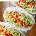 Tacos with copycat Taco Bell taco sauce on top.